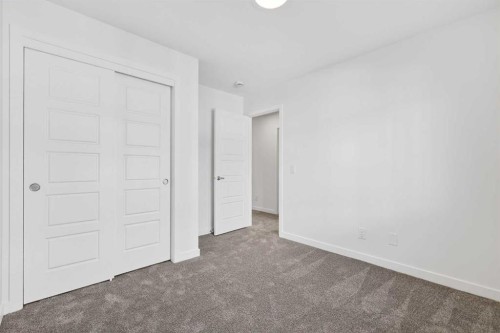 54 Creekside Way Sw, Calgary, AB - Indoor Photo Showing Other Room
