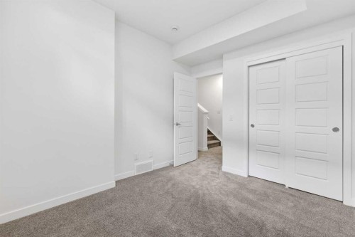 54 Creekside Way Sw, Calgary, AB - Indoor Photo Showing Other Room