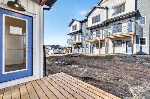 54 Creekside Way Sw, Calgary, AB - Outdoor With Balcony With Deck Patio Veranda