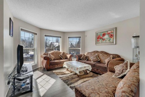 92 Taradale Drive Ne, Calgary, AB - Indoor Photo Showing Living Room
