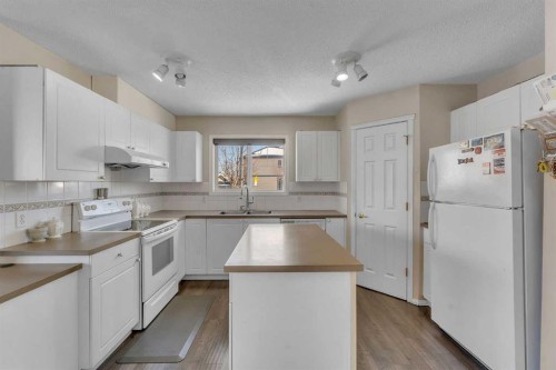 92 Taradale Drive Ne, Calgary, AB - Indoor Photo Showing Kitchen With Double Sink