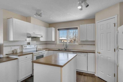 92 Taradale Drive Ne, Calgary, AB - Indoor Photo Showing Kitchen With Double Sink