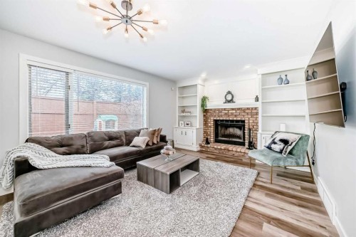 47 Canterbury Court Sw, Calgary, AB - Indoor Photo Showing Living Room With Fireplace
