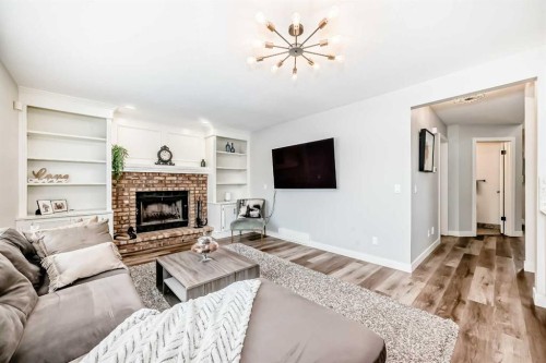 47 Canterbury Court Sw, Calgary, AB - Indoor Photo Showing Living Room With Fireplace