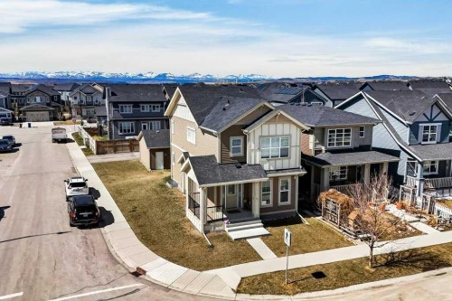 231 Sundown Road, Cochrane, AB - Outdoor With Facade