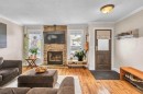 4532 Montgomery Avenue Nw, Calgary, AB  - Indoor Photo Showing Living Room With Fireplace 