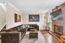 4532 Montgomery Avenue Nw, Calgary, AB  - Indoor Photo Showing Living Room With Fireplace 
