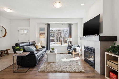 8 Walgrove Green Se, Calgary, AB - Indoor Photo Showing Living Room With Fireplace