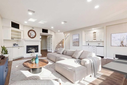 1656 Evergreen Hill Sw, Calgary, AB - Indoor Photo Showing Living Room With Fireplace