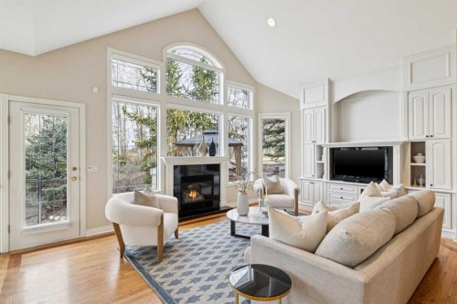 1656 Evergreen Hill Sw, Calgary, AB - Indoor Photo Showing Living Room With Fireplace