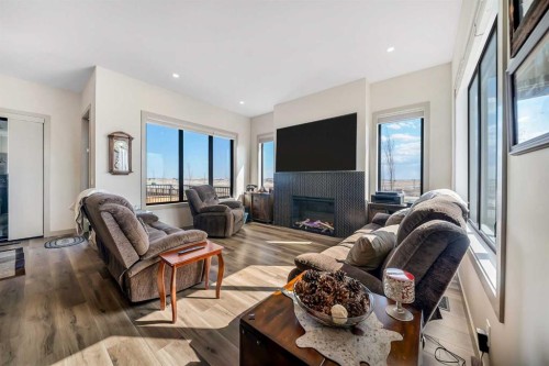 349 Limestone Bay, Balzac, AB - Indoor Photo Showing Living Room With Fireplace