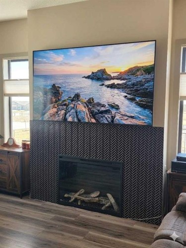 349 Limestone Bay, Balzac, AB - Indoor With Fireplace