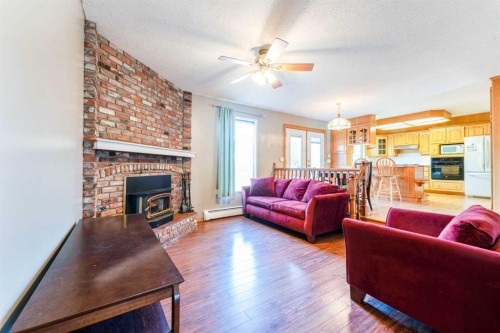 5306 57 Avenue, Olds, AB - Indoor Photo Showing Living Room With Fireplace