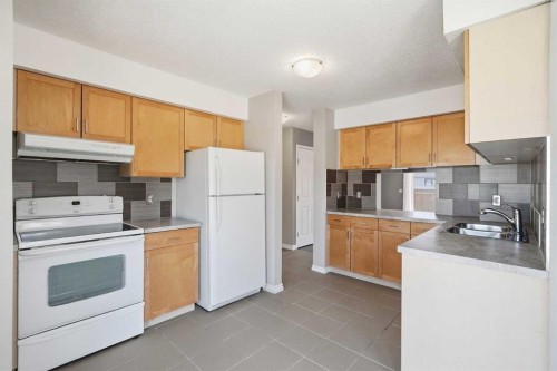 55 Templegreen Drive Ne, Calgary, AB - Indoor Photo Showing Kitchen With Double Sink