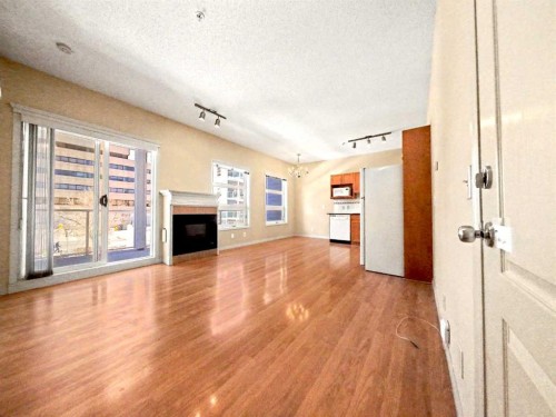 209-333 Riverfront Avenue Se, Calgary, AB - Indoor With Fireplace