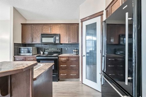 59 Cranberry Place Se, Calgary, AB - Indoor Photo Showing Kitchen