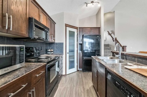 59 Cranberry Place Se, Calgary, AB - Indoor Photo Showing Kitchen With Double Sink