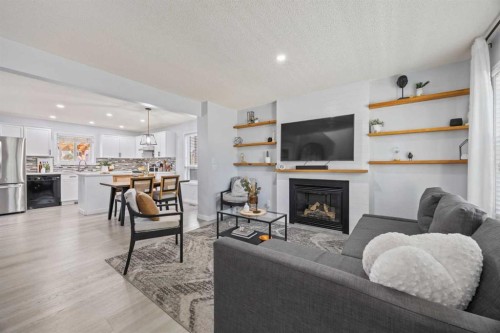 371 Silverado Drive Sw, Calgary, AB - Indoor Photo Showing Living Room With Fireplace