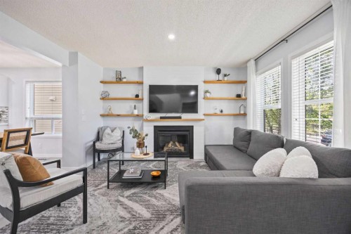 371 Silverado Drive Sw, Calgary, AB - Indoor Photo Showing Living Room With Fireplace