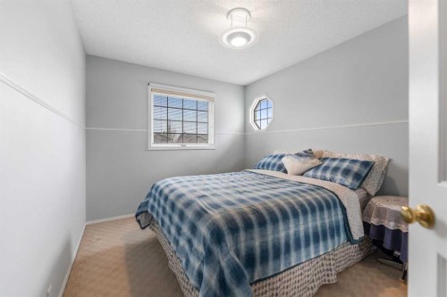 14950 Mt Mckenzie Drive Se, Calgary, AB - Indoor Photo Showing Bedroom