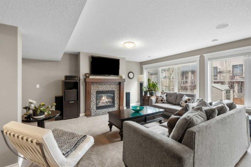 89 Ascot Crescent Sw, Calgary, AB - Indoor Photo Showing Living Room With Fireplace