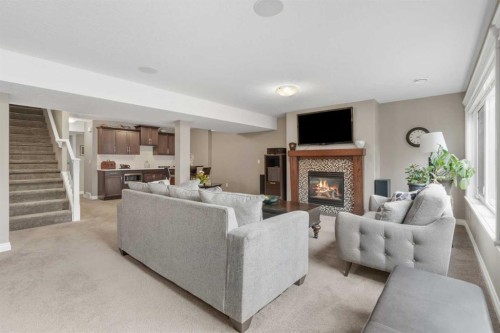 89 Ascot Crescent Sw, Calgary, AB - Indoor Photo Showing Living Room With Fireplace