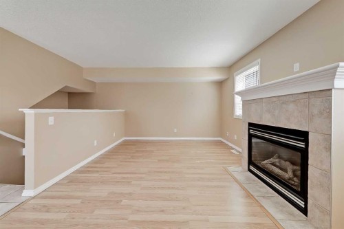 40 Simcoe Place Sw, Calgary, AB - Indoor With Fireplace
