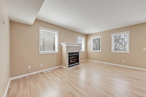 40 Simcoe Place Sw, Calgary, AB - Indoor Photo Showing Living Room With Fireplace