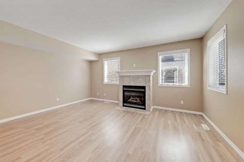 40 Simcoe Place Sw, Calgary, AB - Indoor Photo Showing Living Room With Fireplace
