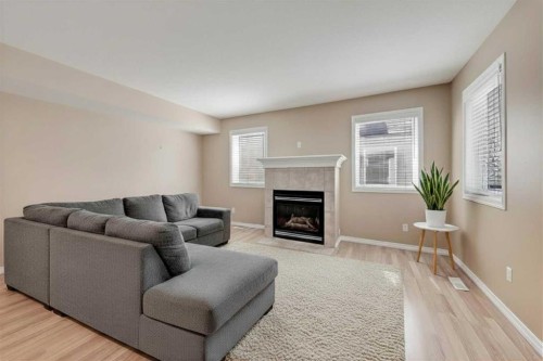 40 Simcoe Place Sw, Calgary, AB - Indoor Photo Showing Living Room With Fireplace