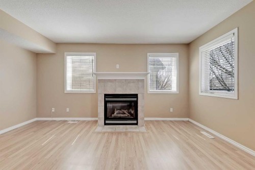 40 Simcoe Place Sw, Calgary, AB - Indoor Photo Showing Living Room With Fireplace