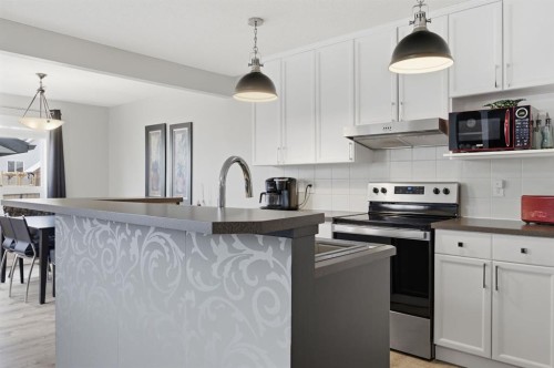44 Cimarron Grove Way, Okotoks, AB - Indoor Photo Showing Kitchen With Upgraded Kitchen