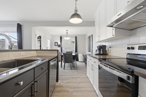 44 Cimarron Grove Way, Okotoks, AB - Indoor Photo Showing Kitchen With Double Sink