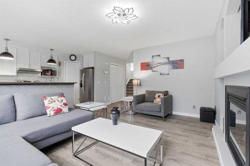 44 Cimarron Grove Way, Okotoks, AB - Indoor Photo Showing Living Room With Fireplace