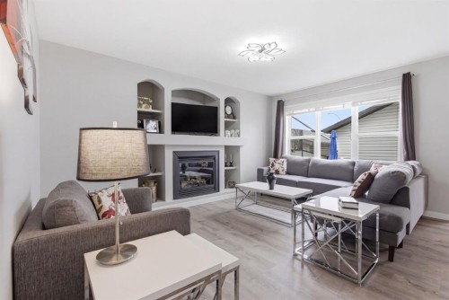 44 Cimarron Grove Way, Okotoks, AB - Indoor Photo Showing Living Room With Fireplace
