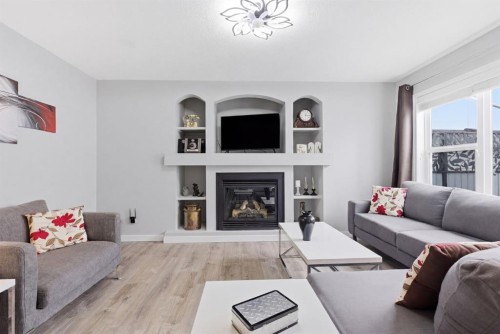 44 Cimarron Grove Way, Okotoks, AB - Indoor Photo Showing Living Room With Fireplace
