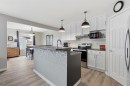 44 Cimarron Grove Way, Okotoks, AB  - Indoor Photo Showing Kitchen With Upgraded Kitchen 