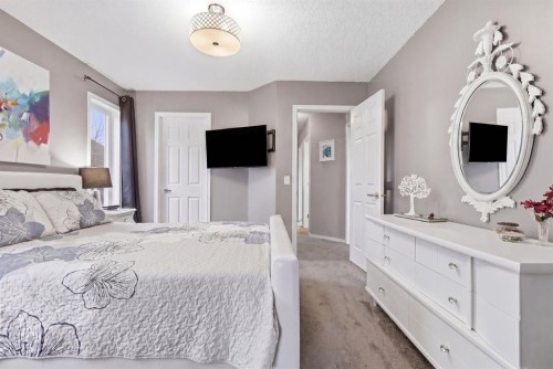 44 Cimarron Grove Way, Okotoks, AB - Indoor Photo Showing Bedroom