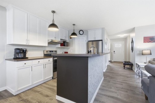 44 Cimarron Grove Way, Okotoks, AB - Indoor Photo Showing Kitchen With Upgraded Kitchen