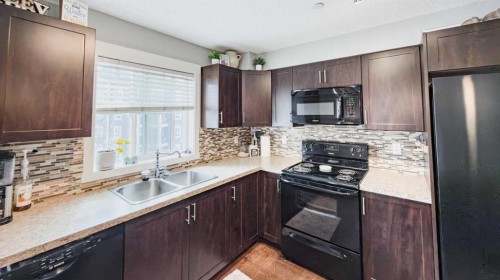 3312-279 Copperpond Common Se, Calgary, AB - Indoor Photo Showing Kitchen With Double Sink