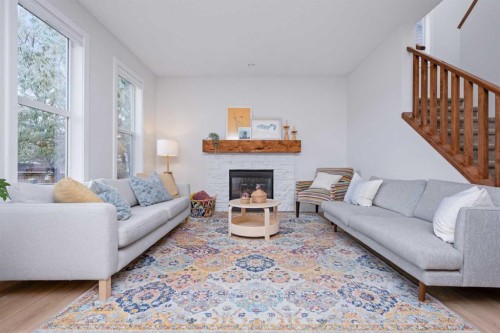 160 Prestwick Manor Se, Calgary, AB - Indoor Photo Showing Living Room With Fireplace