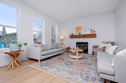 160 Prestwick Manor Se, Calgary, AB - Indoor Photo Showing Living Room With Fireplace