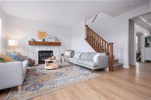 160 Prestwick Manor Se, Calgary, AB - Indoor Photo Showing Living Room With Fireplace