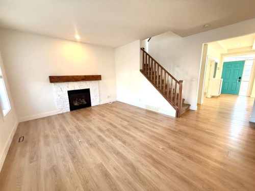 160 Prestwick Manor Se, Calgary, AB - Indoor Photo Showing Living Room With Fireplace