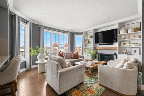 178 Windridge Road Sw, Airdrie, AB - Indoor Photo Showing Living Room With Fireplace