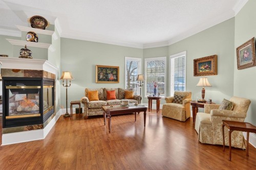331 Mt Douglas Court Se, Calgary, AB - Indoor Photo Showing Living Room With Fireplace