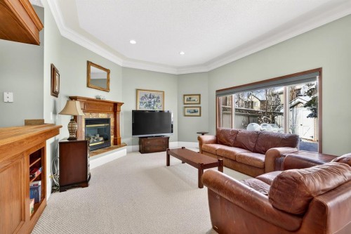 331 Mt Douglas Court Se, Calgary, AB - Indoor Photo Showing Living Room With Fireplace