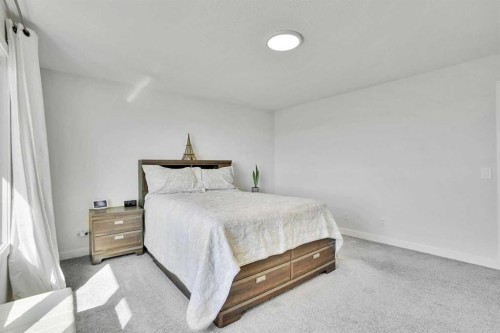 183 Brander Avenue, Langdon, AB - Indoor Photo Showing Bedroom