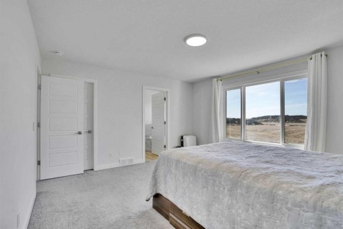 183 Brander Avenue, Langdon, AB - Indoor Photo Showing Bedroom