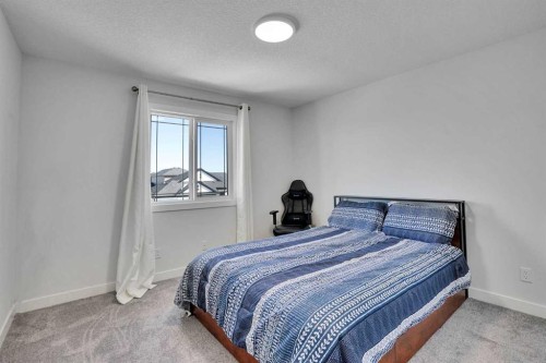 183 Brander Avenue, Langdon, AB - Indoor Photo Showing Bedroom